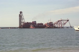 Dredging conducted to generate draft for vessels. Dredge material used to expand dikes.