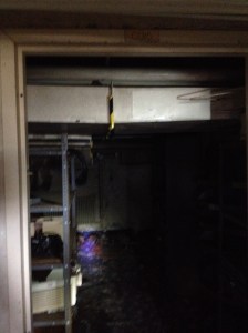 Duct work on other side of a door.  Note the warning tape on the sharp joint