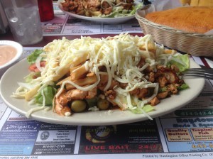 You can just see a piece of salad poking out under the chips and cheese