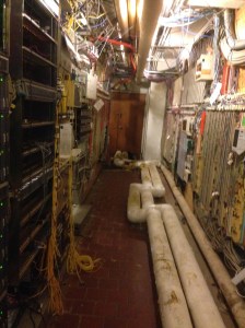Another basement room with abandoned hardwiring to the Pentagon. About 45U of high grade servers in here. The pipe on the floor is for chilled water with heavily damaged insulation allowing condensate to form on it in the summer.