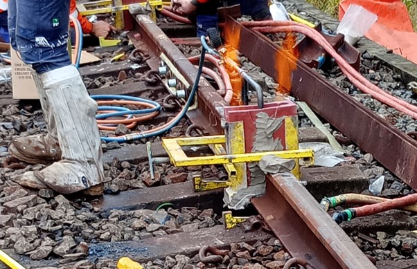 Preheating the rail ends.